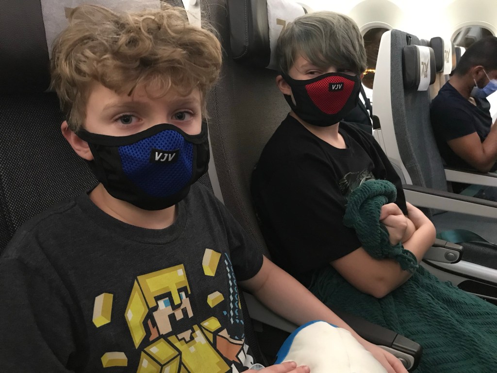 Boys in airplane seats